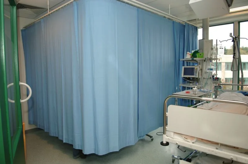 An example of a hospital bed with the curtain closed.