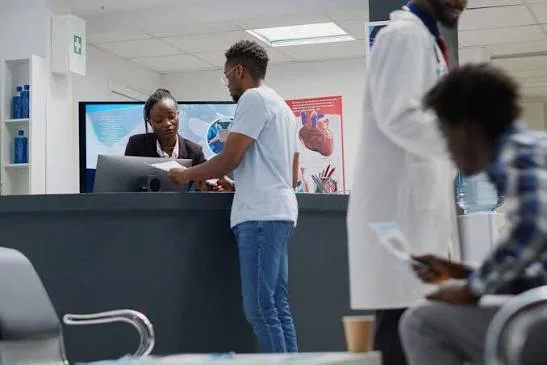 An example of a receptionist at a hospital desk.